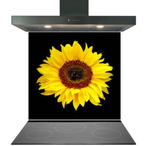 A digital composite image of a vibrant sunflower superimposed on the front of a kitchen stove hood over an induction cooktop, featuring a Kitchen Glass Splashback Toughened & Heat Resistant - Design No. 2021.