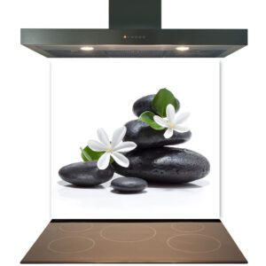 Modern kitchen stove with a stylized presentation of balanced stones and flowers atop the induction cooktop, featuring a Kitchen Glass Splashback Toughened & Heat Resistant - Design No. 2021.