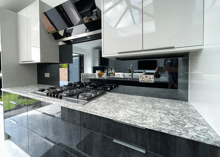 marble worktop with grey toughened mirror splashback